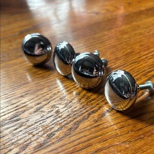 Set of Four Chrome Knobs with Screws
